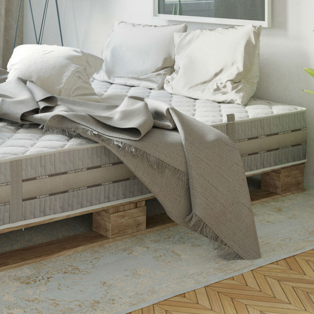 Veneto mattress with pillows and a throw