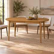 Erie extendable dining table, natural oil — in a dining room interior